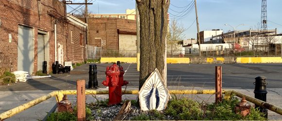 The Virgin of Bush Terminal: A statue of the Virgin Mary in a parking lot at Bush Terminal in Brooklyn.